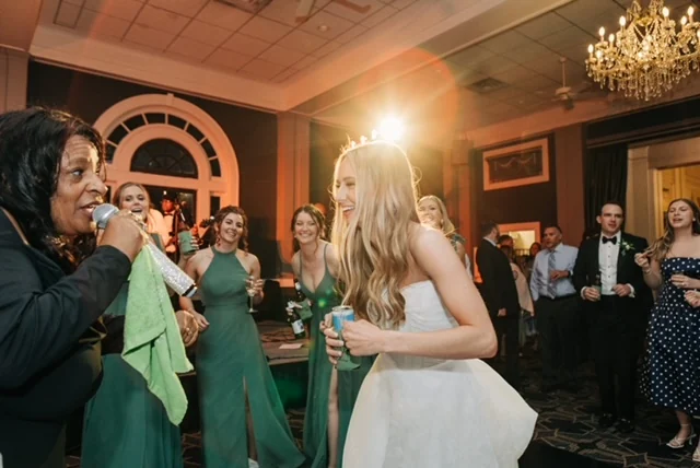 Encore of Lexington's vocalist singing as the bride and bridesmaids celebrate